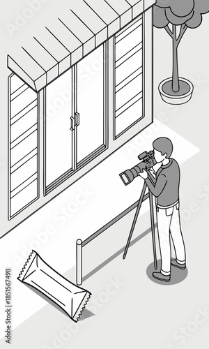 A cameraman filming a building with a tripod capturing the scene with professional equipment.