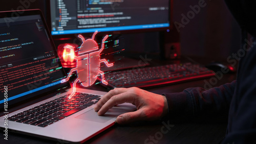 Hacker hand laptop malware cyber security data breach cyber attack code hologram threat concept in dark room modern workspace