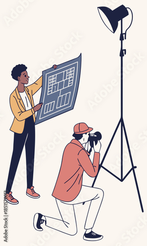 Two people working together on a professional photoshoot with a camera and lighting equipment.