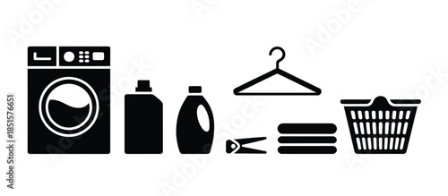 A collection of laundry items, including a washing machine, detergent, hangers, clothes, and a basket.