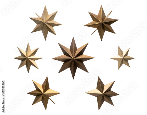 Arrangement of seven metallic, pointed star shapes on black