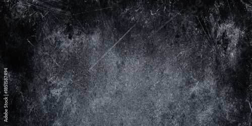 A monochromatic grainy texture dominates the image exhibiting subtle variations in tone and a distressed aged appearance