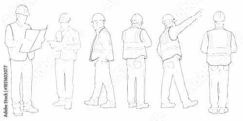 A group of construction workers discussing plans and pointing at something