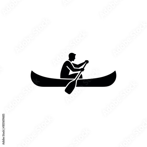 Silhouette of a person paddling a canoe on still waters