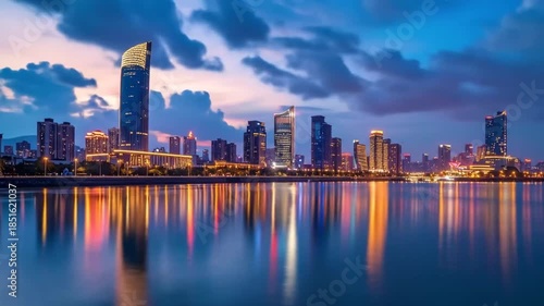 Wallpaper Mural Illuminated City Skyline Reflecting in Calm Water at Dusk Torontodigital.ca