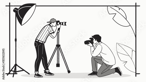 Two photographers capturing images in a studio setting with lighting equipment.