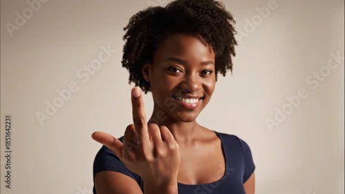 Woman Performing Middle Finger Hand Gesture on Clean Minimalist Background With Cinematic Lighting