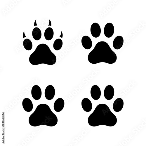 Set of four black dog paw print icons on white background