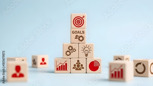 Building blocks representing business success strategy with goals, teamwork, and growth charts