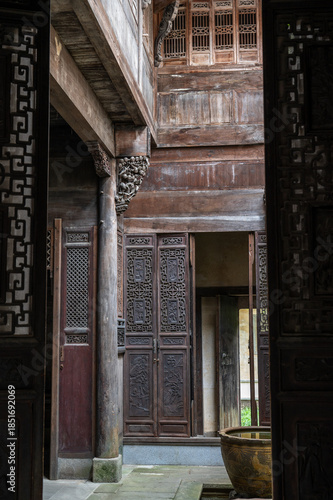 Gorgeous traditional Chinese building of Hui-style architecture, beautiful sunlight shines on the door, in Anhui Province, China.