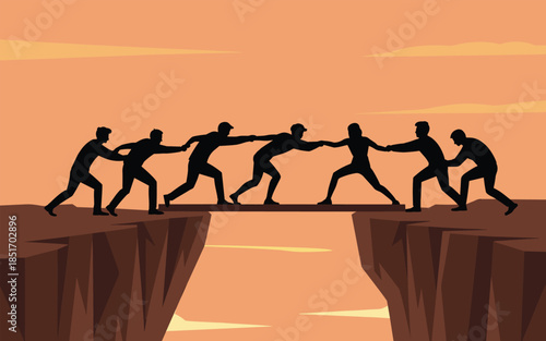 Group of people working together to bridge the gap between two cliffs