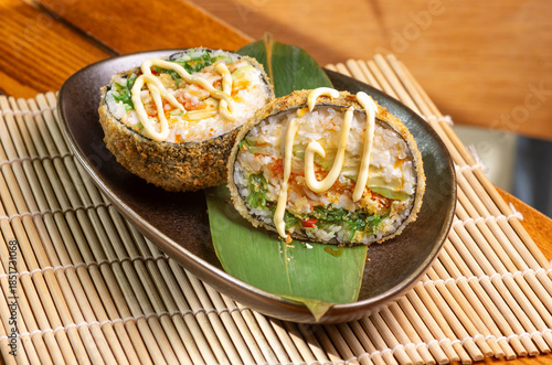 Crispy sushi burger with shrimp and avocado Japanese sushi burger with seafood and avocado Fried sushi burger with salmon, shrimp and rice