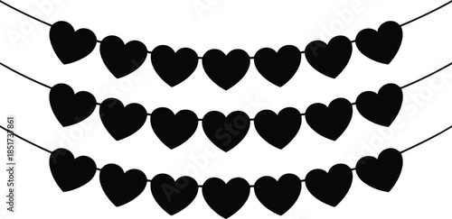 Black heart shaped banners are arranged in three charming rows on a plain white surface for festive decor