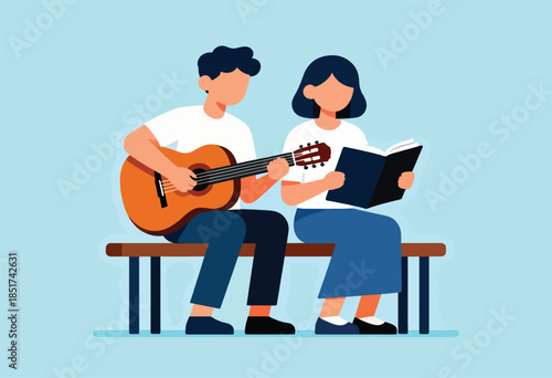 A person plays guitar while another reads a book, seated on a bench