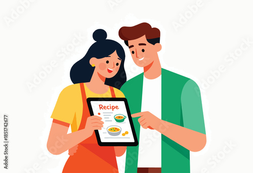Couple using a tablet to view a recipe with images of soup