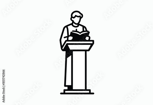 Person standing at a podium, reading from a book