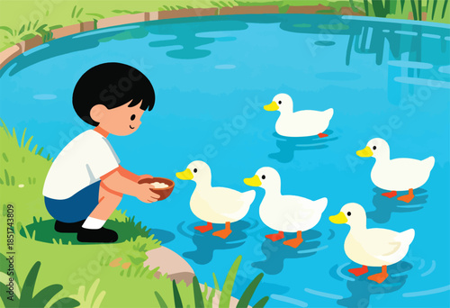 Boy feeding ducks in a pond