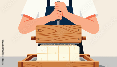 Person presses tofu using a wooden mold and a metal screw mechanism