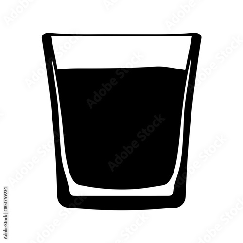 A glass of dark liquid