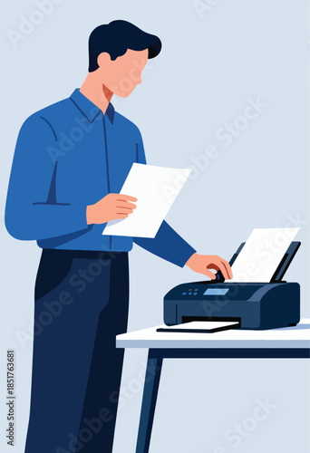 Man in blue shirt using a printer with paper on a desk