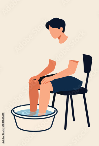 Person sitting on chair soaking feet in water-filled basin