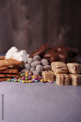 Tableau sur toile a harmonious arrangement of indulgent sweets including chocolate-covered treats,