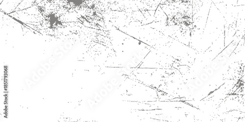 Vintage black and white abstract grunge background featuring a rough concrete wall texture with dirty ink paint splatters and a weathered stone surface design for a rustic wallpaper backdrop