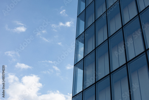 Modern architecture and cloudy blue sky on background