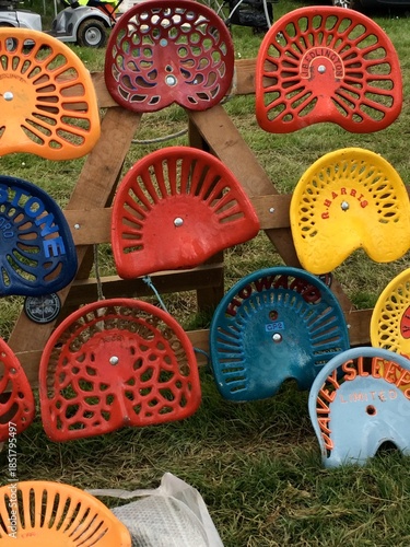 Display of vintage tractor seats 