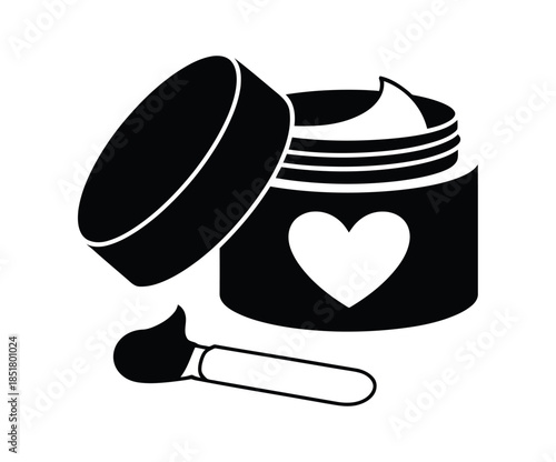 A jar of cream with a heart symbol and a small applicator stick rests nearby.