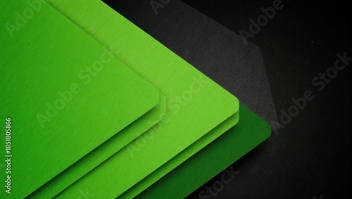 Modern abstract background with overlapping green geometric layers.