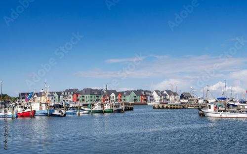 Kerteminde harbour with fishing boats and waterfront houses along Nordre Havnekaj in background, Funen, Denmark