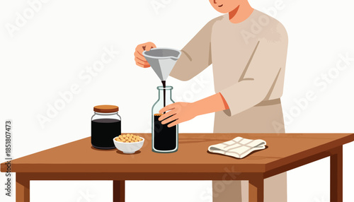 Person pouring dark liquid into a bottle using a funnel