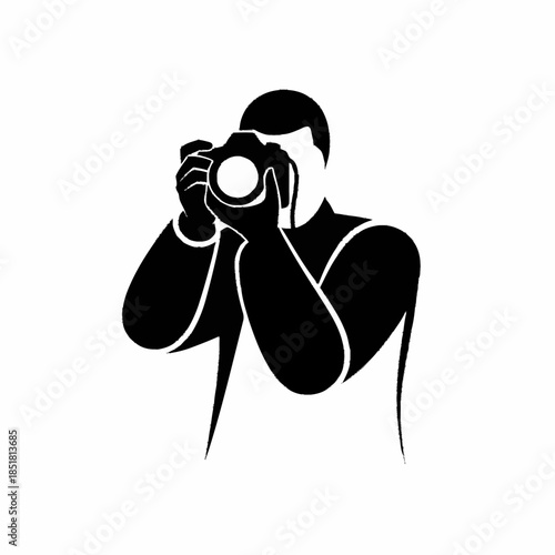 Silhouette of a photographer capturing a moment with a camera.