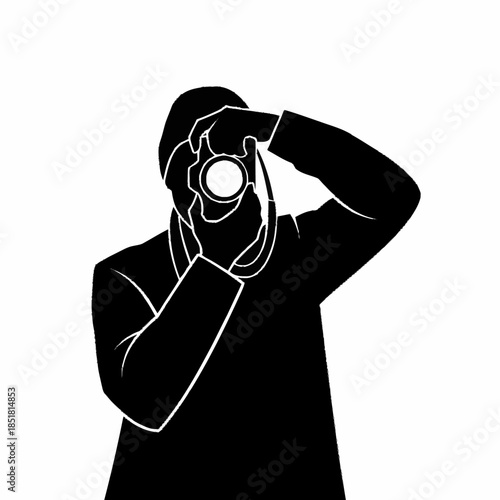 Silhouette of a photographer capturing a moment with a camera.