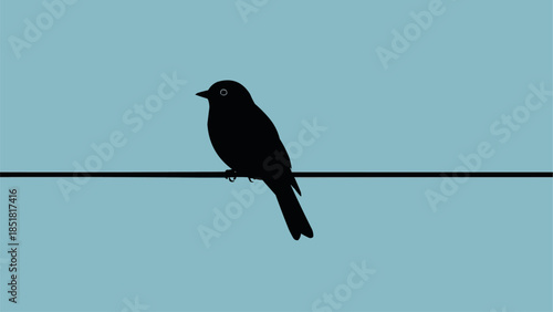 Silhouette of a small bird perched on a wire against a clear blue sky.