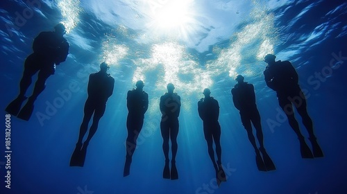 Underwater Navy SEAL Team Swims in Formation with Intense Focus in Natural Daylight