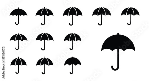 A collection of black silhouette umbrellas in various shapes and sizes