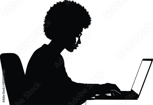 Black silhouette of African American woman with afro hair sitting at desk typing on laptop computer isolated on white background