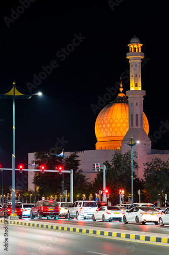Sur, Oman - November 22,2025: Close-up Night View of the Distinctive Illuminated Dome and Minaret of Bahwan Mosque in Sur, Oman