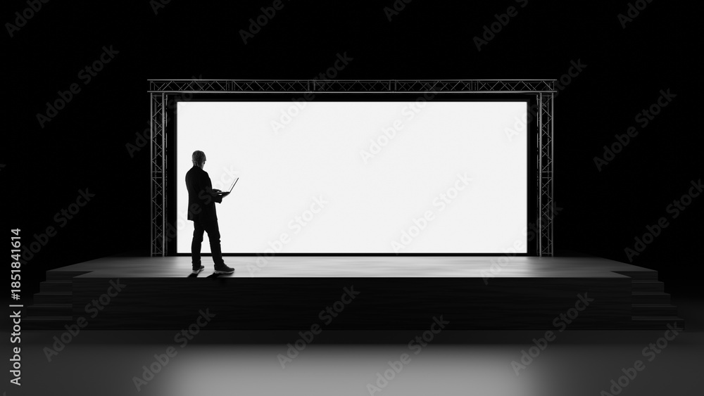Obraz premium Presentation setup and digital content control performed by a professional with a laptop on a stage facing a large screen. Event production, keynote preparation, visual communication