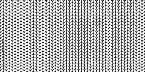 Close up view of a knitted fabric texture with a repeating pattern