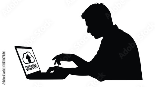 Silhouette of a person intensely typing on a laptop displaying a cloud uploading icon