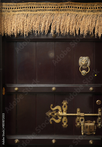 Indian traditional main door in house with lion knocker and trident designed door latch or aldrop 