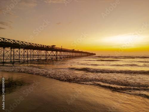 Summer sunset at the port of Pimentel, with a view of the pier in Chiclayo, Lambayeque, on the Peruvian coast