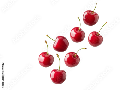 Fresh red cherries with stems floating in air