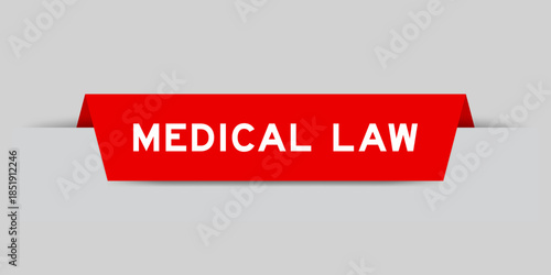 Red color inserted label with word medical law on gray background