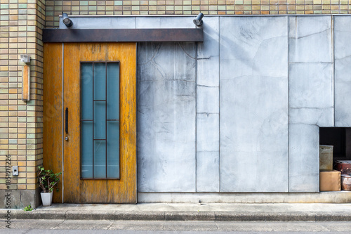 sidewalk by street wall  and  door