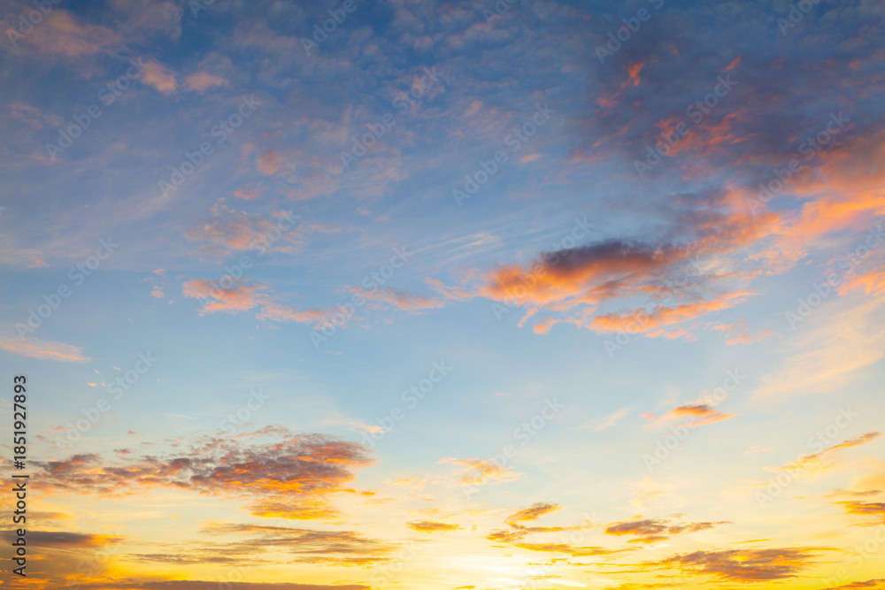 Naklejka premium Majestic real sunrise sundown sky background with gentle colorful cloud,Colorful clouds and sky in the morning,Real majestic sunrise sundown sky background with gentle colorful clouds without birds.