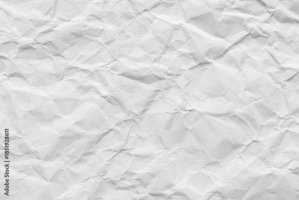 Fototapeta premium Close-up macro view of a wrinkled white paper surface,A high-angle view of a sheet of white paper, crumpled and wrinkled into an intricate, abstract texture. Perfect for backgrounds, mockups.